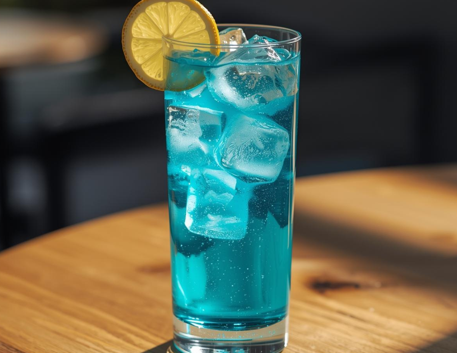 Your Ultimate Guide to Protein Supplements A refreshing glass of clear blue protein water with ice and lemon.
