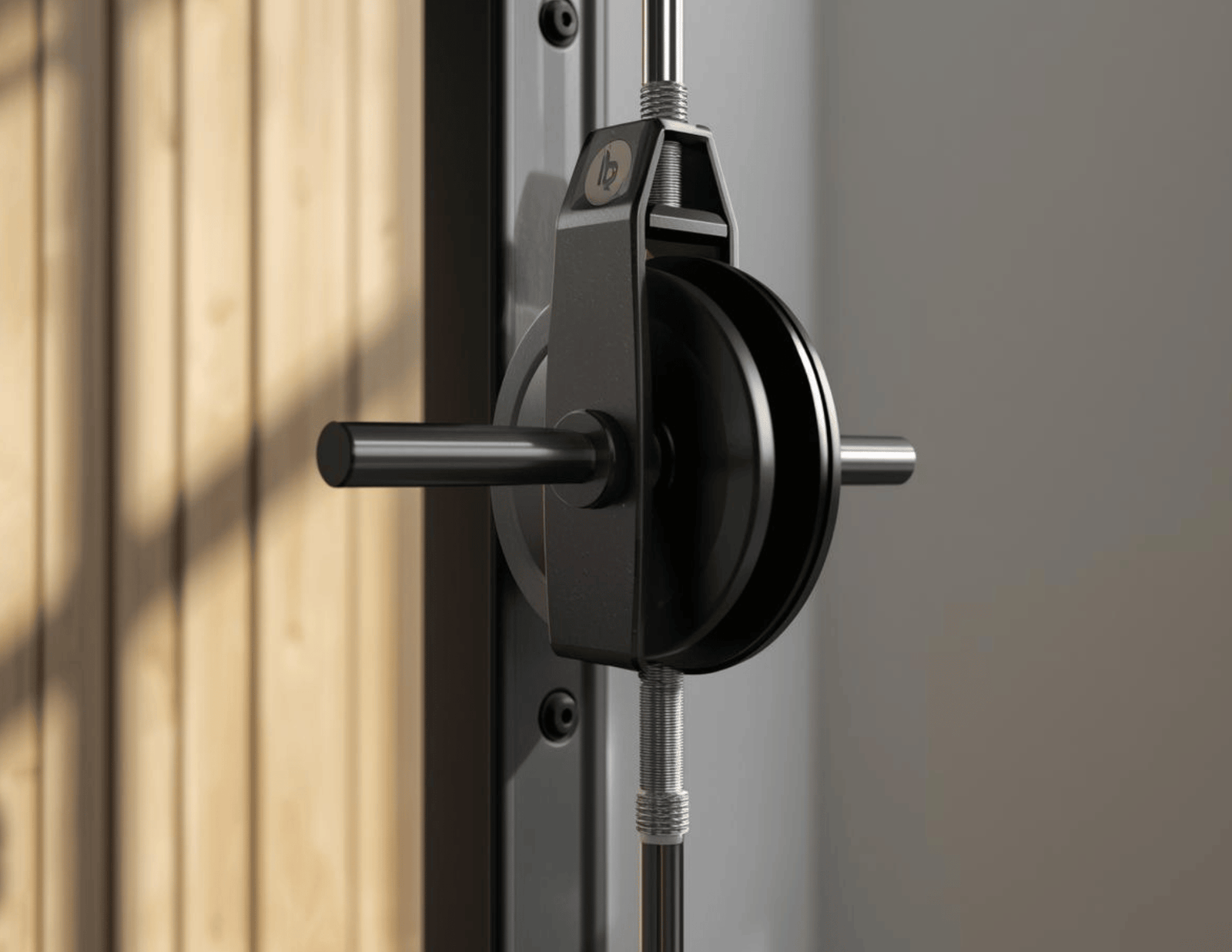 Best Home Gym Equipment to Build Your Complete At-Home Workout Space Close-up of a professional black cable system against wood and white walls.